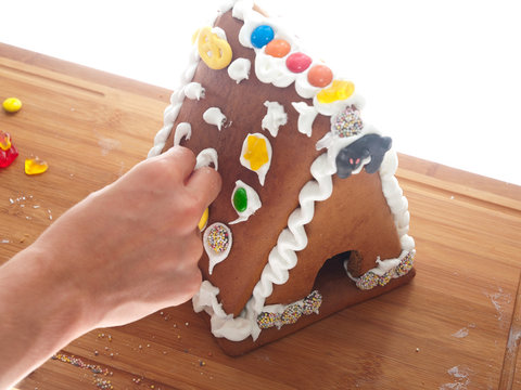 decorating a gingerbread house