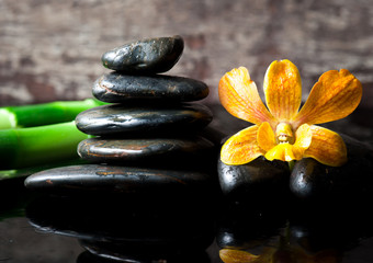 Obraz na płótnie Canvas spa concept zen stones and orchid,wood background