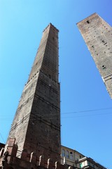 The Two Towers "Garisenda" and "Asinelli" of Bologna in Italy under blue sky