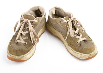 old sneakers on white background