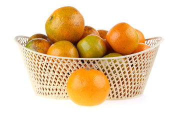 orange fruit in basket, isolated on white background
