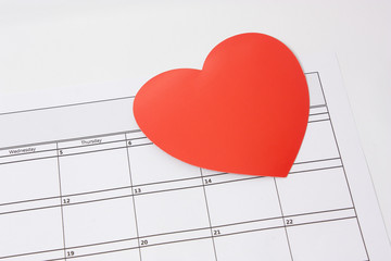 A heart for Valentines day / The concept of Valentines day with a Heart shapes on the calender for 14th February