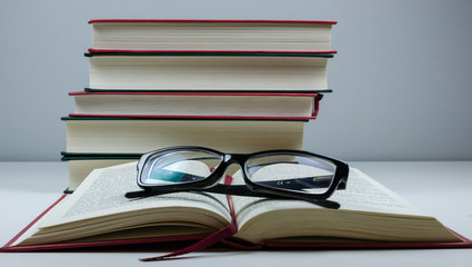 Open book and reading glasses