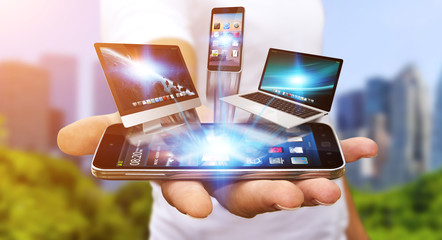 Businessman holding tech device in his hand