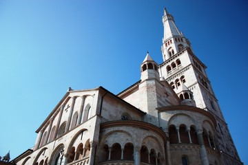 White Cathedral under blue sky in Modena, Italy 