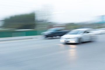 Fototapeta premium car driving on road with traffic jam in the city, abstract blurred