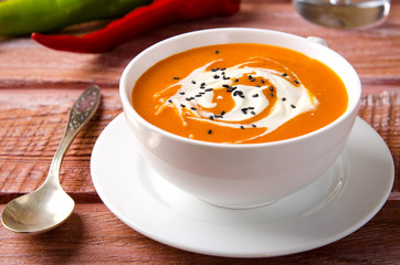 Pumpkin Soup with tomatoes, chili, yogurt and black sesame seeds