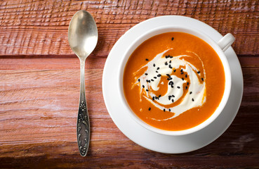 Pumpkin Soup with tomatoes, chili, yogurt and black sesame seeds