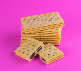 Biscuits on pink background