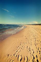 Baltic sea beach with many footstep, Poland.