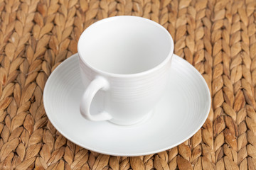 white ceramic earthenware cup