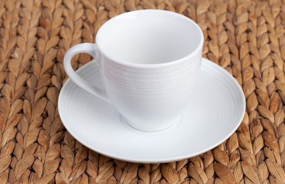 white ceramic earthenware cup