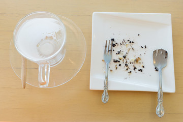leftover of milk with glass on wood table