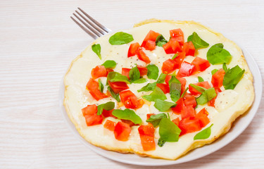Omelet with tomato and cheese