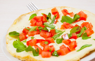 Omelet with tomato and cheese