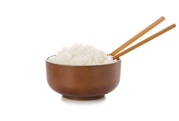Fototapeta na wymiar Rice in bowl and chopsticks on white background