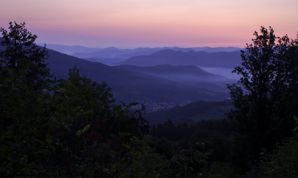 Blue Hills in Morning Sunrise Framed by Trees