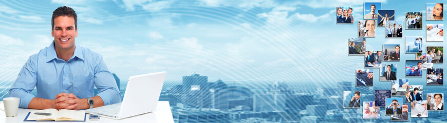 Young businessman with laptop.