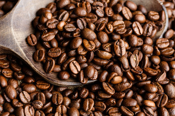 Coffee beans on a wooden spoon