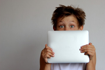 teen boy with tablet