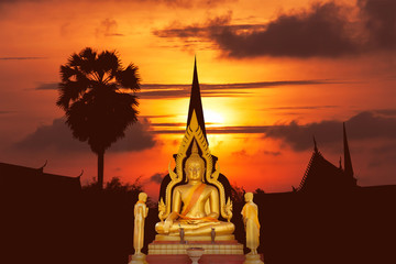 Buddha image on the temple sunset in Thailand