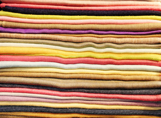 Folded scarfs and fabrics background