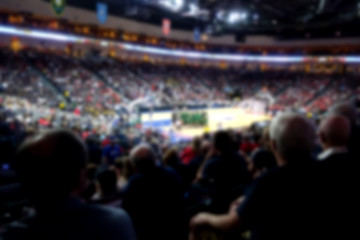 blurred basketball crowd watching game in arena