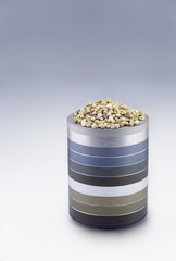 Hemp seeds on metallic rings pedestal