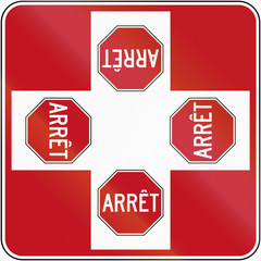 Regulatory road sign in Quebec, Canada - 4-way intersection with stop signs and priority to right. Arret means stop