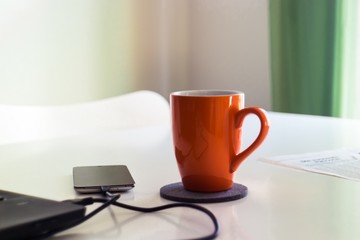 Red cup on an office table