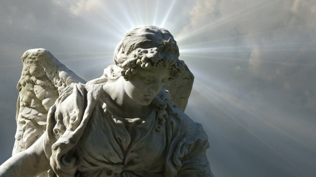 Angel 0107: The statue of an Angel on time lapse clouds (Loop).