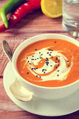 Pumpkin Soup with tomatoes, chili, yogurt and black sesame seeds
