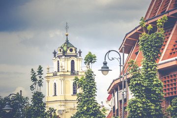 bell tower in the morning light in Vilnius on background blue sk