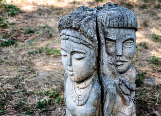Fototapeta na wymiar The wooden figure of a man and woman