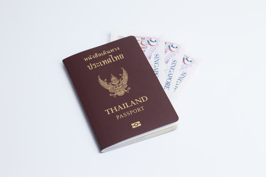 Thai passport with singapore currency