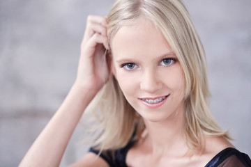 Fototapeta premium Close up portrait of young blons smiling woman.