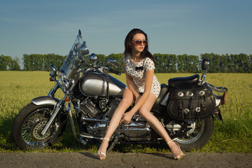 Fototapeta na wymiar Sexy woman on motorcycle