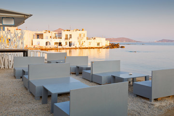 Fototapeta premium Coffee shop on the beach in Naousa village on Paros island, Greece