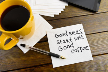 Super ideas start with good coffee -  handwriting on a napkin