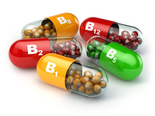 Vitamin B. Capsules B1 B2 B6 B12 on white isolated background. - obrazy, fototapety, plakaty