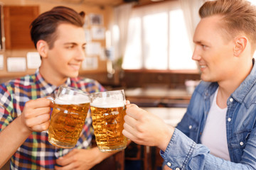 Contented friend drinking beer 