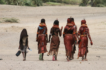 A group of Turkana women walk home after rehersals for the  Turkana Festival performance