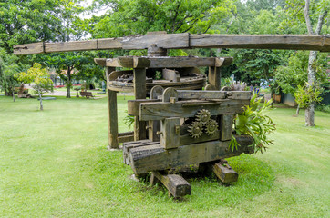 Sugar cane mill.Old wooden mill to squeeze sugarcane.
