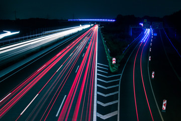 Traffic light trails on a german highway by night - 91221456