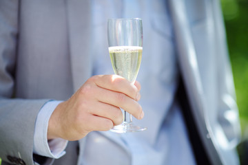 Man holding glass with champagne