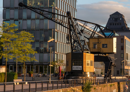 Public dock with a harbour crane and a restaurant