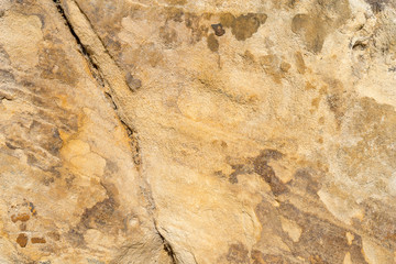 Detailed textured background of sandstone.