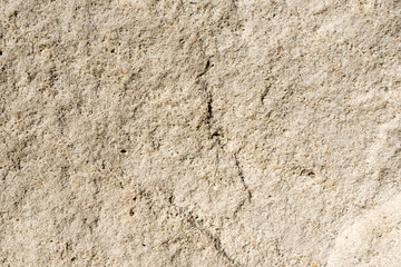 Detailed textured background of sandstone.
