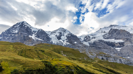 Fototapeta premium View of Eiger, Monch and Jungfrau massif from Kleine Scheidegg railway station on Swiss Alps, Switzerland, Europe