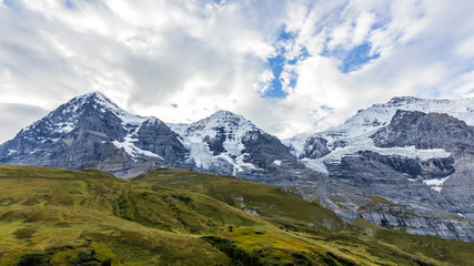 View of Eiger, Monch and Jungfrau massif from Kleine Scheidegg railway station on Swiss Alps, Switzerland, Europe